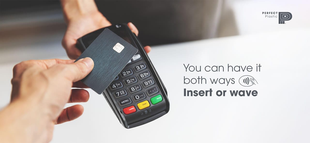 EMV chip card being tapped and inserted at payment terminal for contact and contactless transactions